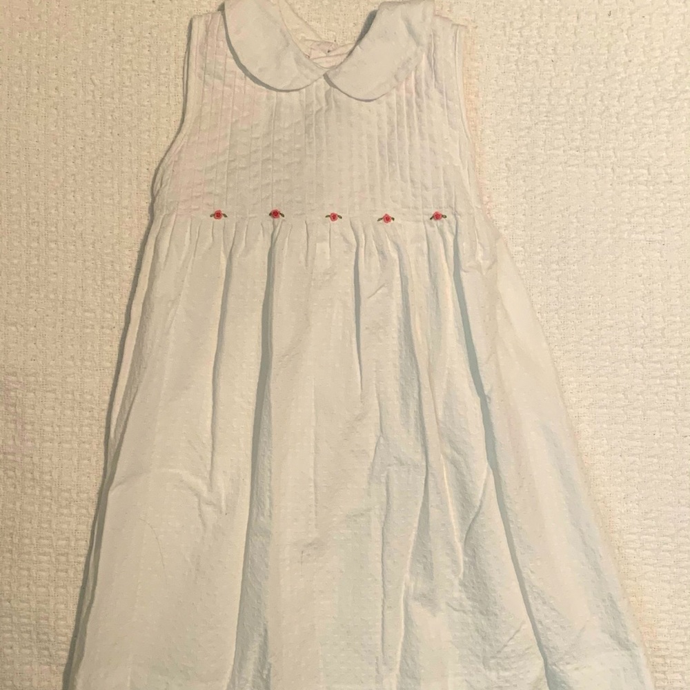 White dress with pink flower detail